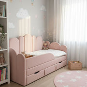 Children's bedroom with a pink bed, teddy bears, and decorative elements.